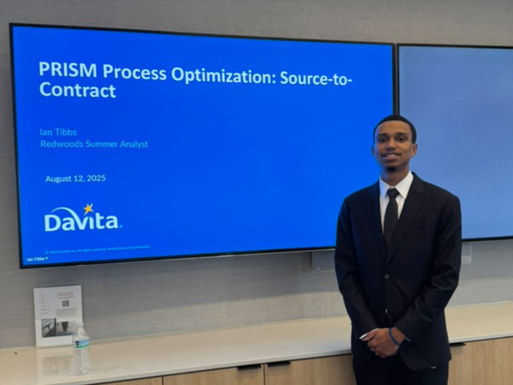 Florida A&M University graduate Ian Tibbs poses at DaVita during his internship experience, a pivotal step in the journey that helped launch his professional career and prepare him for graduate school. (Photo courtesy: Ian Tibbs)