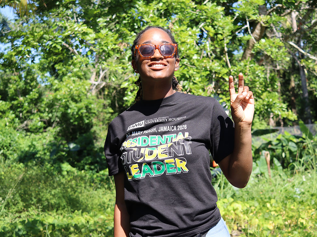 A Florida A&M University student smiles during a service-learning experience in St. Mary, Jamaica, where participants engaged in community outreach, cultural immersion and sustainability initiatives throughout the weeklong trip. The international experience encouraged students to broaden their perspectives while developing leadership and teamwork skills beyond the classroom. (Photo Courtesy: Ernest Nelfrard)