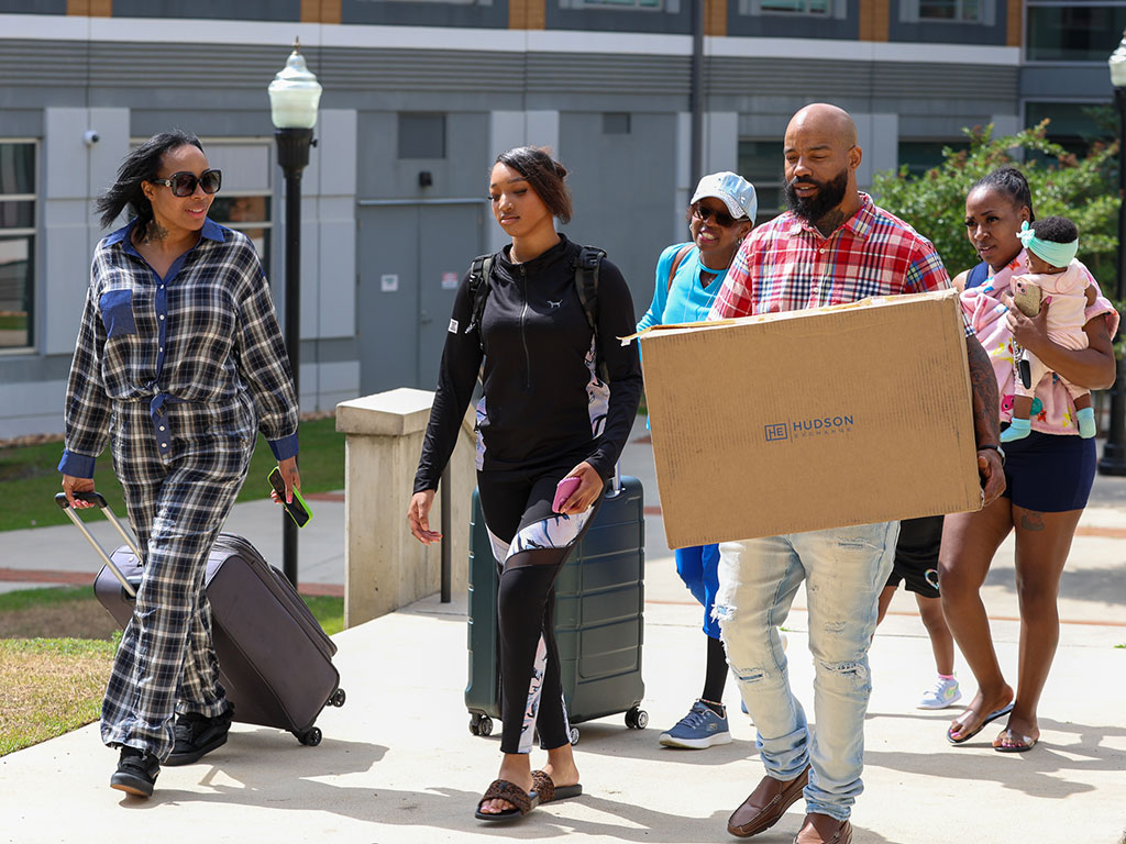 Students and families navigate move-in day as they arrive on campus. Florida A&M University alumni-founded New Life Campus aims to ease the transition through student-focused moving and storage services. (Photo Courtesy: Inspiring Visuals)
