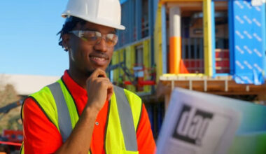 Da’Mari Clayton reviews engineering plans on-site, reflecting his hands-on experience and growing expertise in the field. (Photo Courtesy: Da’Mari Clayton)