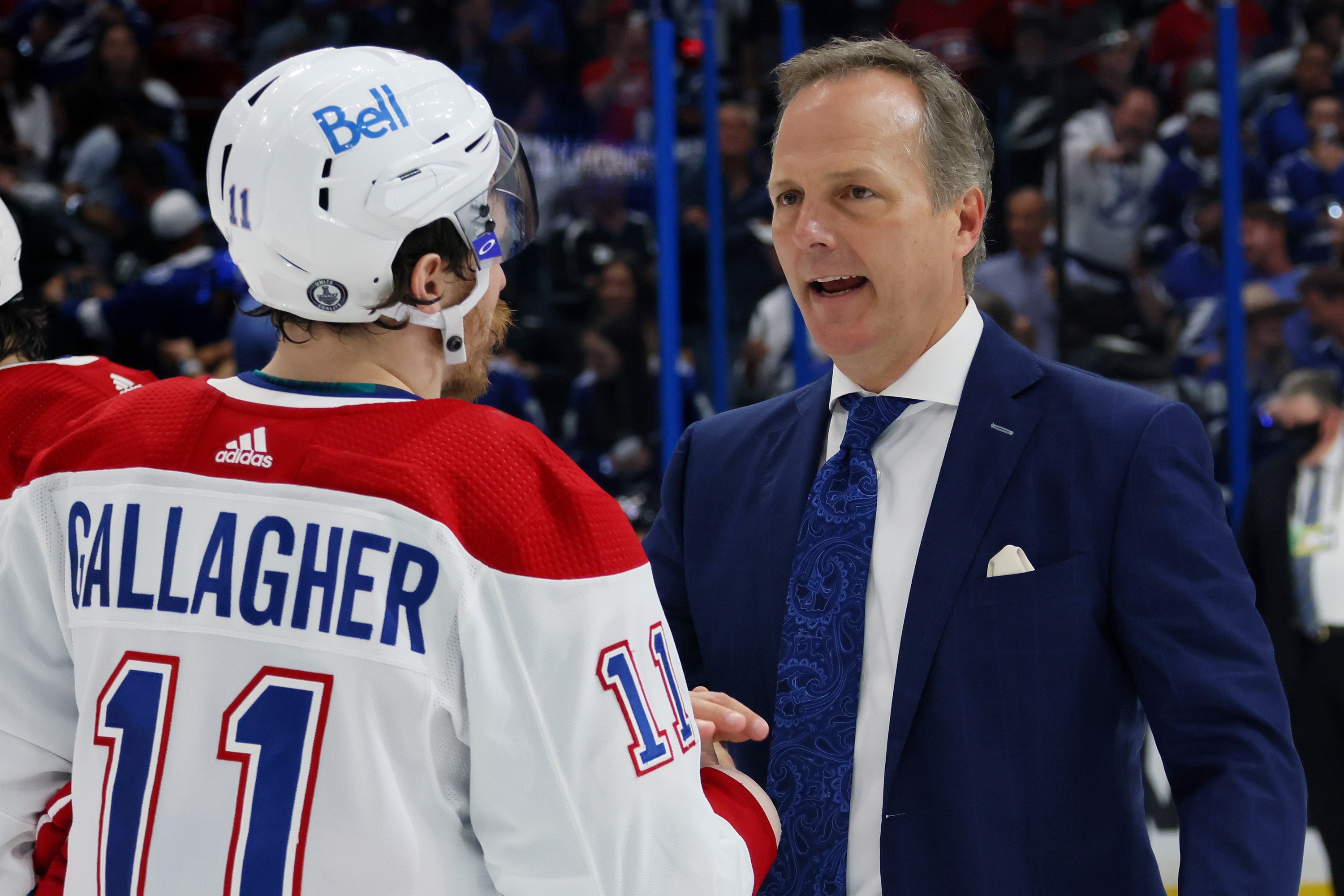 Brendan Gallagher and Jon Cooper shake hands on the ice.