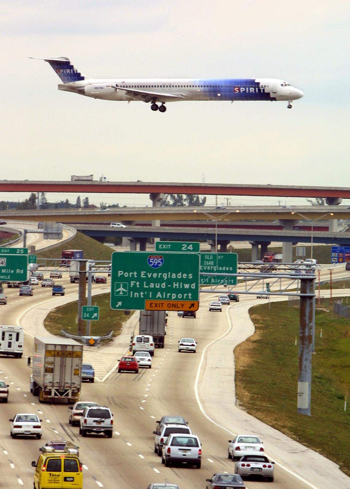 In 2003, a Spirit Airlines plane approaches for a landing at Fort Lauderdale-Hollywood International Airport, with I-95 below.