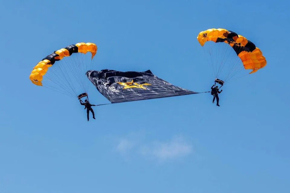 File, 2025: Members of the U.S. Army Golden Knights prepare to land on South Beach during the Hyundai Air & Sea Show, part of Miami Beach’s annual National Salute to America’s Heroes, on Saturday, May 24, 2025.