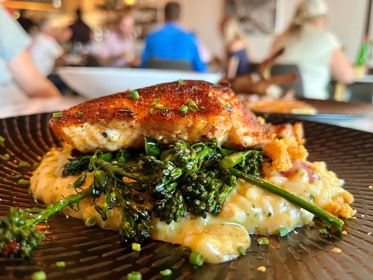 Seared salmon over risotto is a must-get item for us when we visit Next Door in Cape Coral.