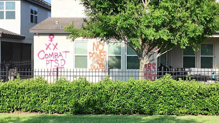 Neighbors on edge after homeowner spray-paints messages on Orlando-area house, Orange County investigates
