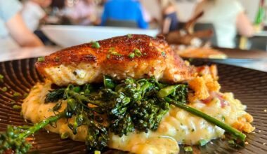 Seared salmon over risotto is a must-get item for us when we visit Next Door in Cape Coral.