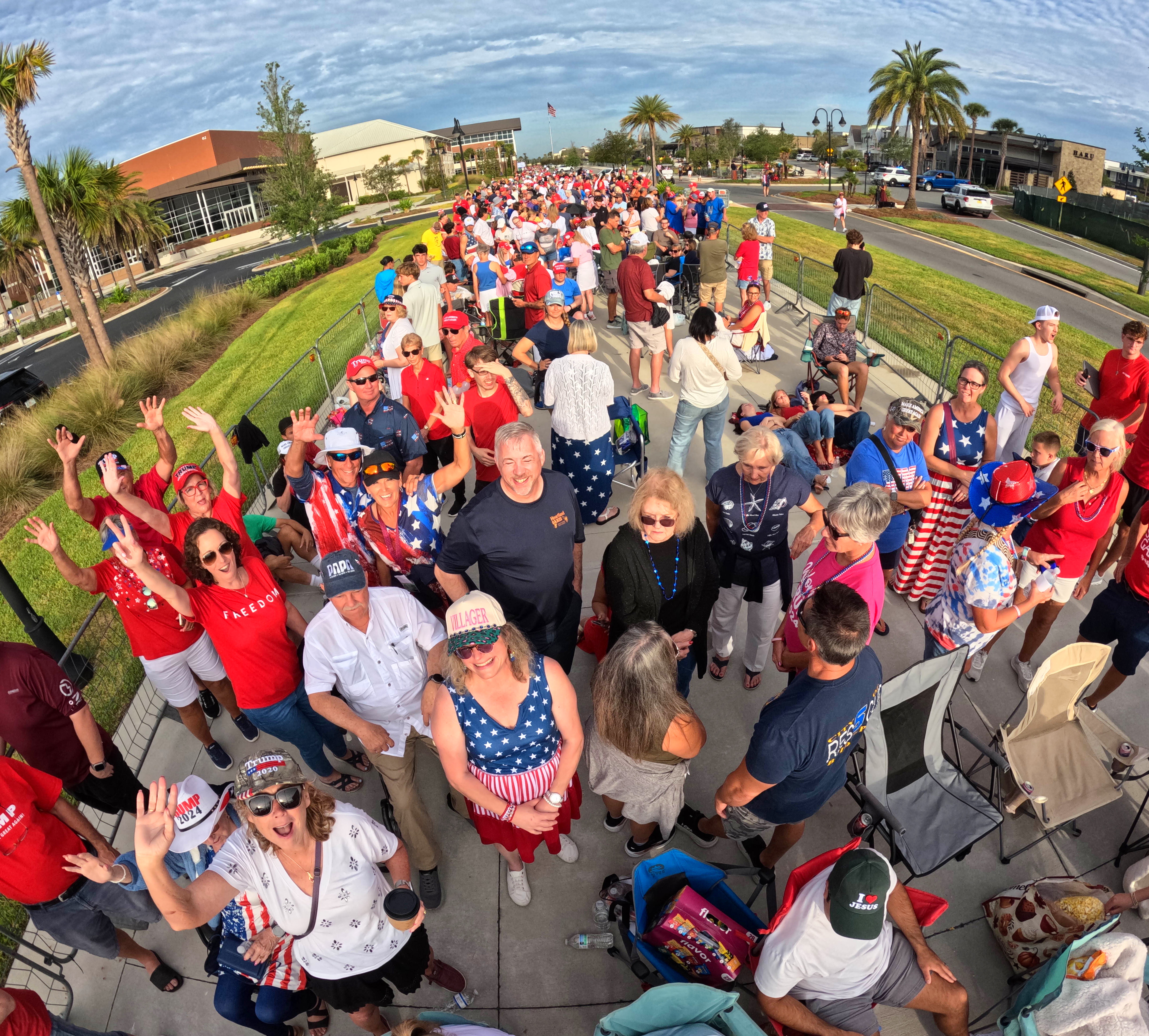 Supporters of President Donald Trump cheer while waiting for doors...