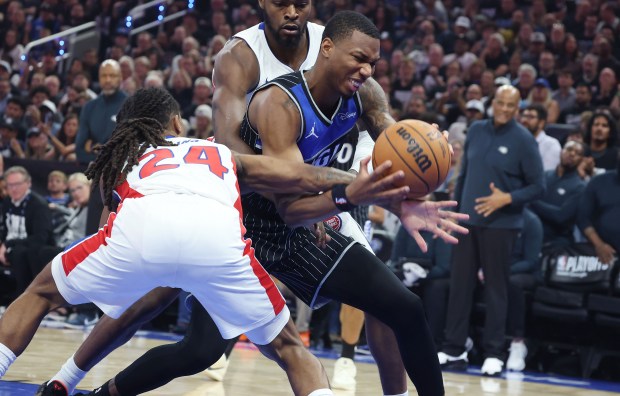 Orlando forward Jamal Cain (right) can't get past Detroit guard Dannis Jenkins (24) during the Detroit Pistons at Orlando Magic game 6 of the NBA Playoffs at the Kia Center in Orlando on Friday, May 1, 2026. Detroit won the game 93-79 to force a game 7 in Detroit. (Stephen M. Dowell/Orlando Sentinel)
