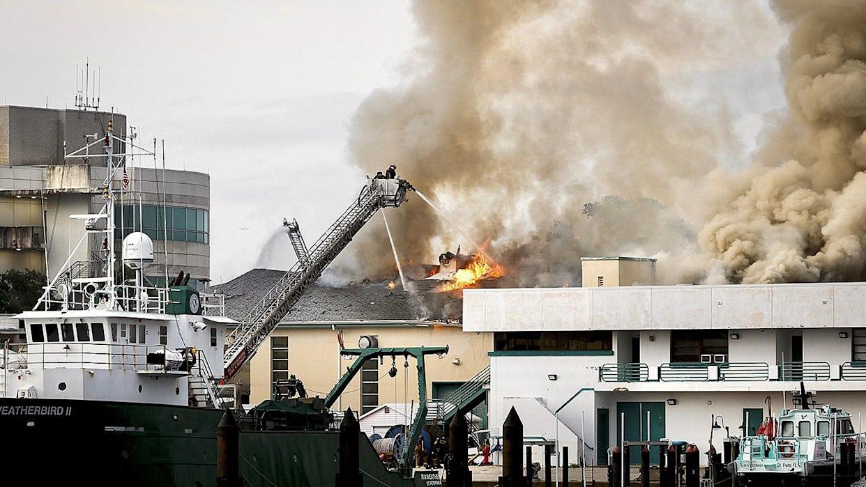 Firefighters extinguishing fire on University of South Florida campus in St. Petersburg