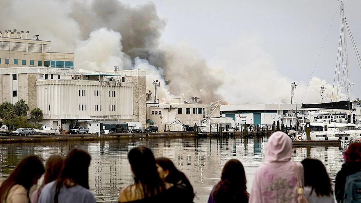 Firefighters extinguishing fire on University of South Florida campus in St. Petersburg