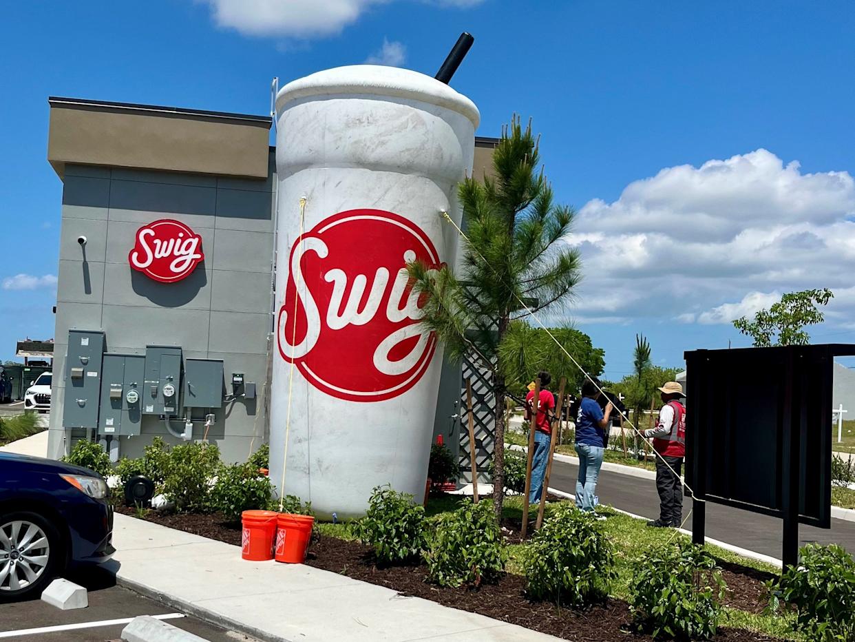 A giant inflatable cup signals that Swig's new location in Cape Coral is now open.