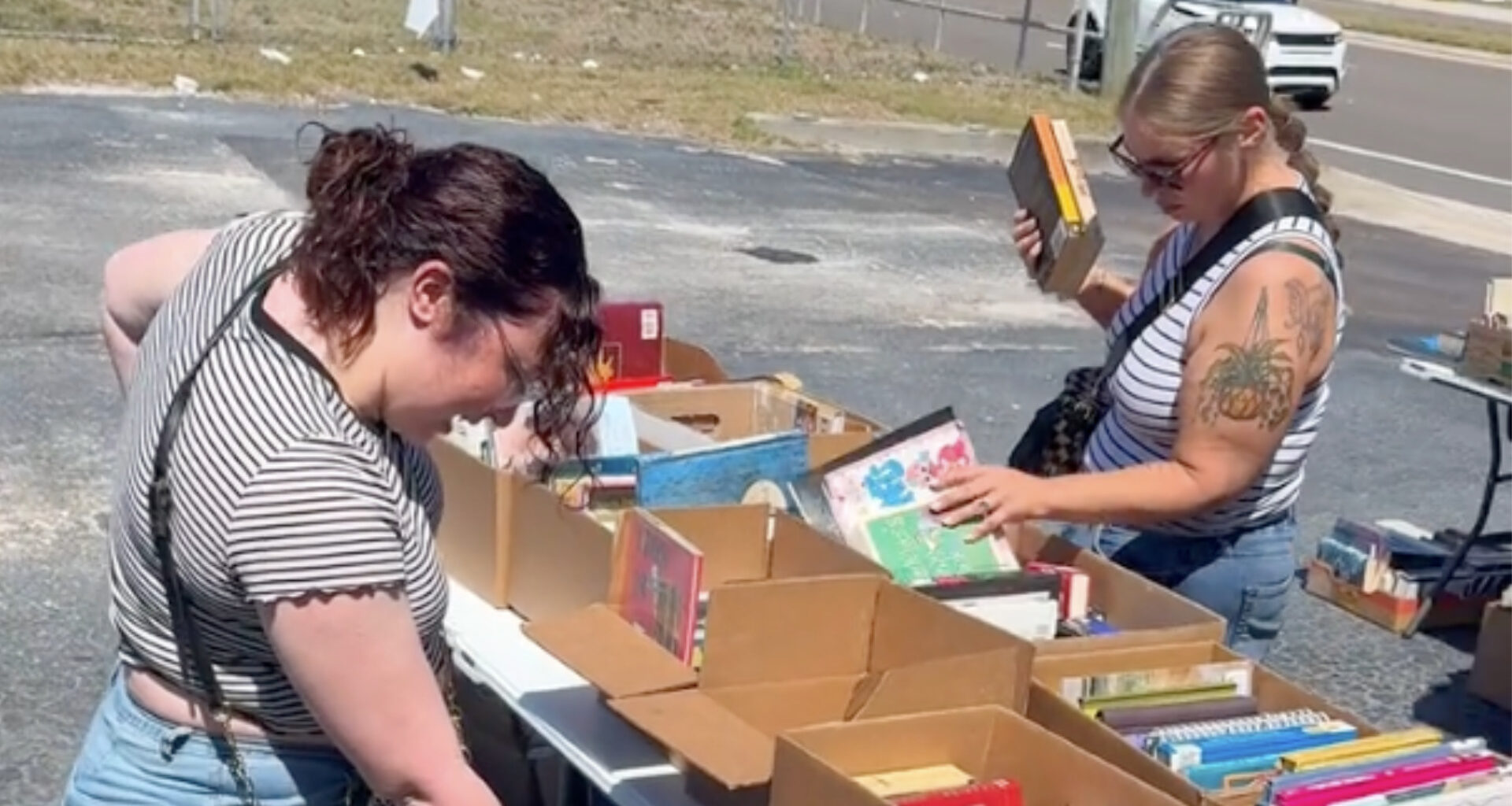 People looking through an outdoor bookstore