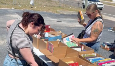 People looking through an outdoor bookstore
