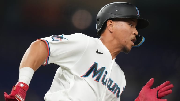 Miami Marlins' Heriberto Hernandez runs after hitting a single during...