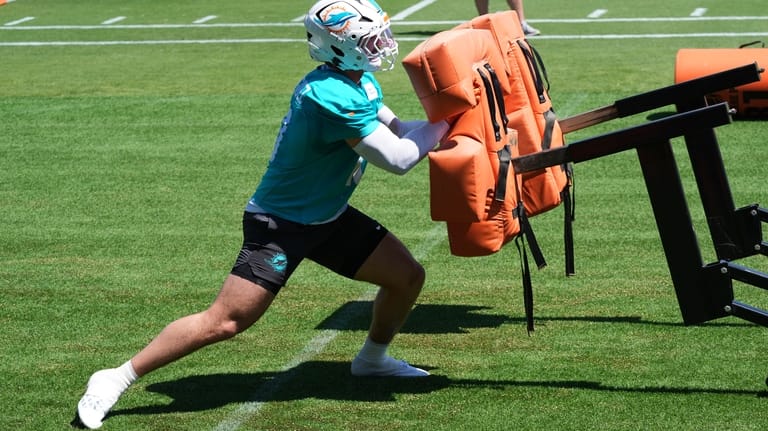 Miami Dolphins linebacker Jacob Rodriguez (10) works out during the...