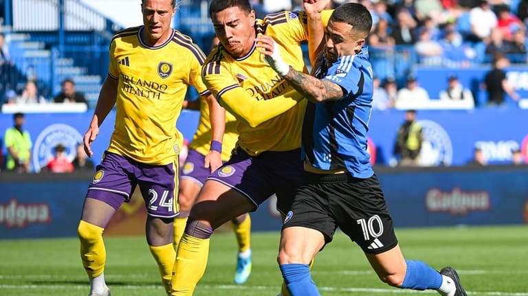 CF Montreal's Ivan Jaime (10) tries to get around Orlando...