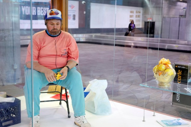 "Vendor with Walkman," by Duane Hanson, is a painted bronze sculpture that sits in Terminal 1 at the Fort Lauderdale-Hollywood International Airport on Wednesday, May 6, 2026. (Amy Beth Bennett / Sun Sentinel)