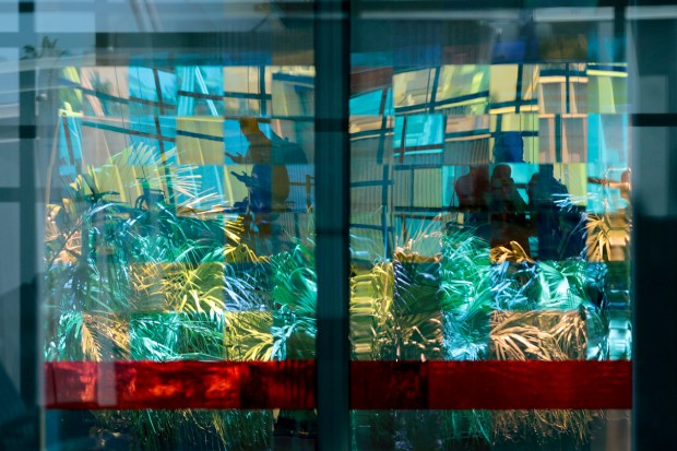"Sunrise to Sunset," by Gordon Huether, is made of individual glass panels hung at the Fort Lauderdale-Hollywood International Airport. It's seen here on Wednesday, May 6, 2026. (Amy Beth Bennett / Sun Sentinel)