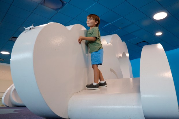 Bodhi Suboyu, 4, launches his toy airplane while playing on "Cloudscape," an interactive play area by Volkan Alkanoglu, at the Fort Lauderdale-Hollywood International Airport on Wednesday, May 6, 2026. (Amy Beth Bennett / Sun Sentinel)