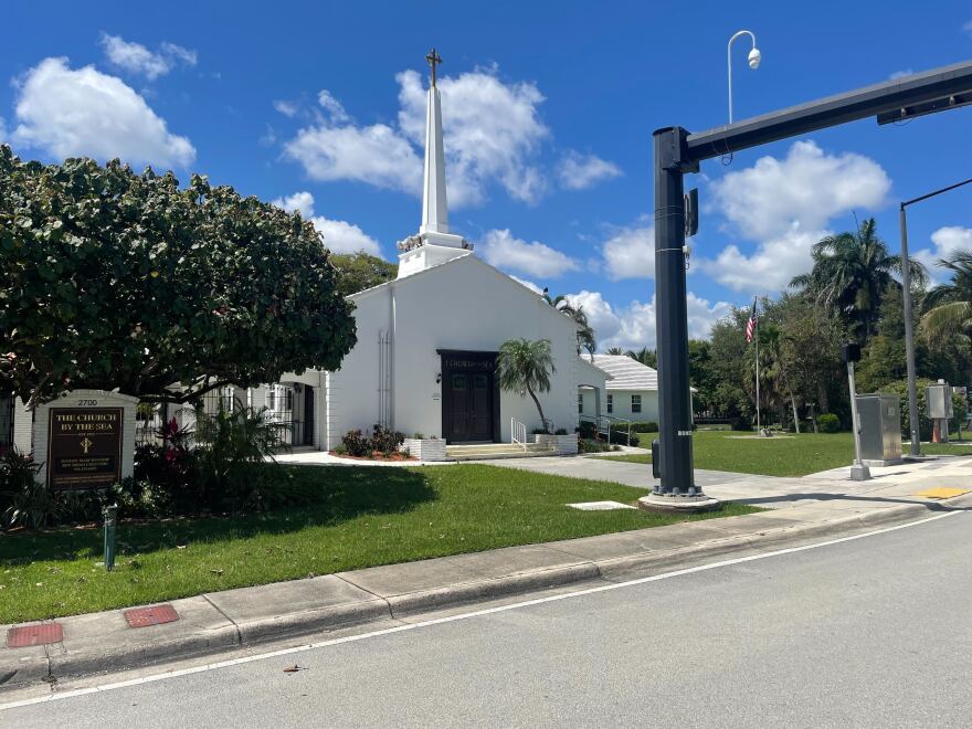 A white building on a street.