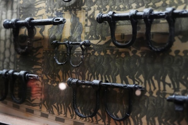 Ankle shackles, some child-sized, recovered from the wreck of the British slave ship Henrietta Marie, are displayed at the Mel Fisher Maritime Museum in Key West, Fla., Saturday, May 9, 2026. (AP Photo/Rebecca Blackwell)