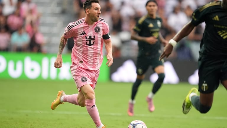 Inter Miami midfielder Leo Messi carries the ball downfield during...