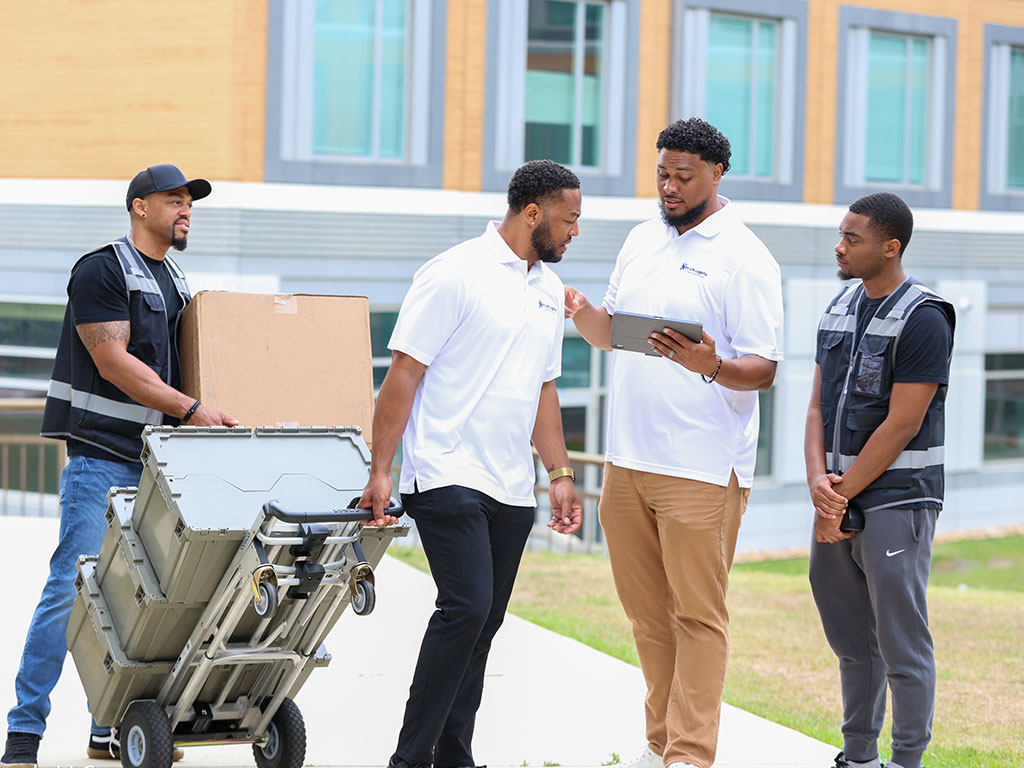Members of the New Life Logistix team prepare move-in equipment as part of the company’s student-focused New Life Campus initiative, designed to simplify the college move-in and storage experience. (Photo Courtesy: Inspiring Visuals)