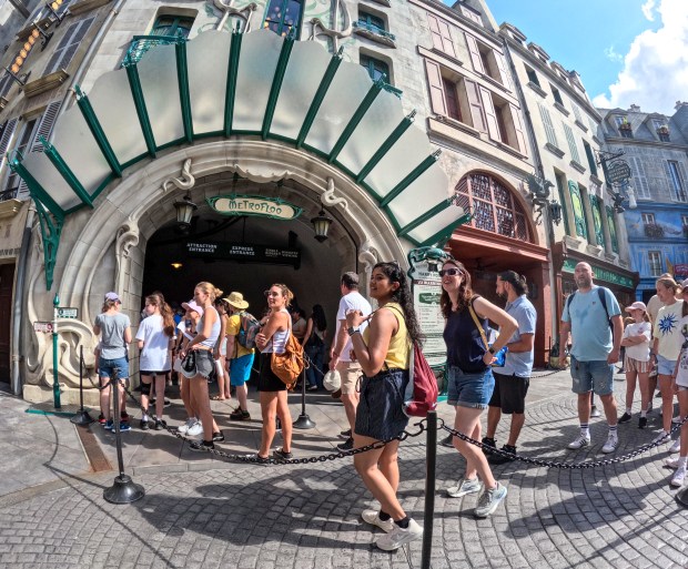 Guests arrive at The Wizarding World of Harry Potter - Ministry of Magic, at Epic Universe on Thursday, the eve of the one-year anniversary of the park's debut (Joe Burbank/Orlando Sentinel)