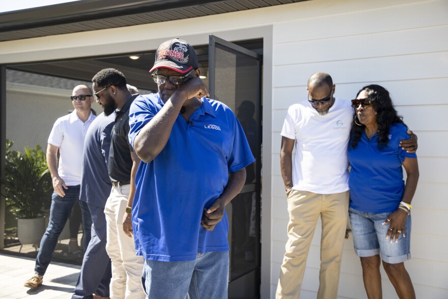 Vietnam Veteran Lewis Freeman, 71, reacts to seeing the back patio of his new home on Friday, May 15, 2026, in Fort Myers. The two-bedroom, two bath home was built in a partnership between Builder’s Care and Pulte Homes on a lot donated by the City of Fort Myers.
