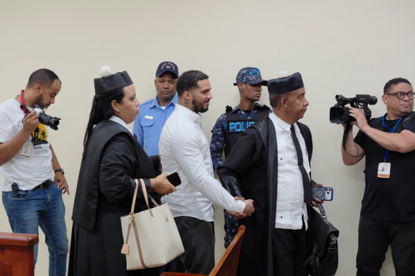 Tampa Bay Rays shortstop Wander Franco, center, leaves court after his trial on charges of sexually abusing a minor in Puerto Plata, Dominican Republic, Monday, May 25, 2026. (AP Photo/Ricardo Hernandez)