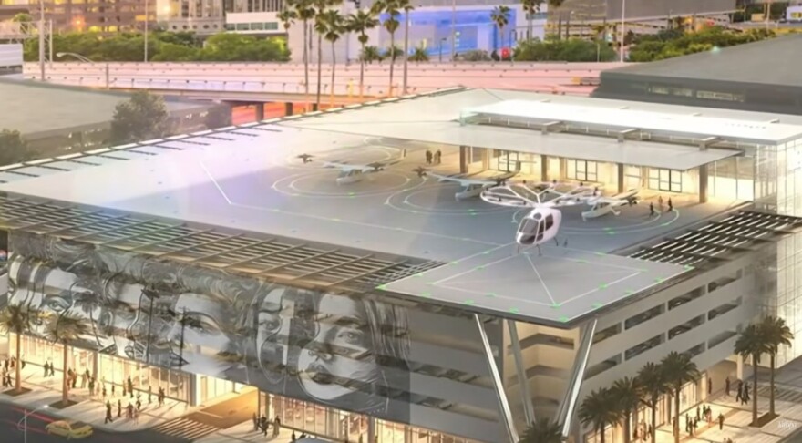 Rendering shows what looks like a helicopter taking off from a pad on top of a building