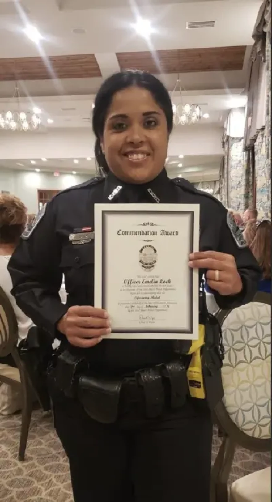Lock holds a commendation awarded to her in 2019. (Special to the Trident)