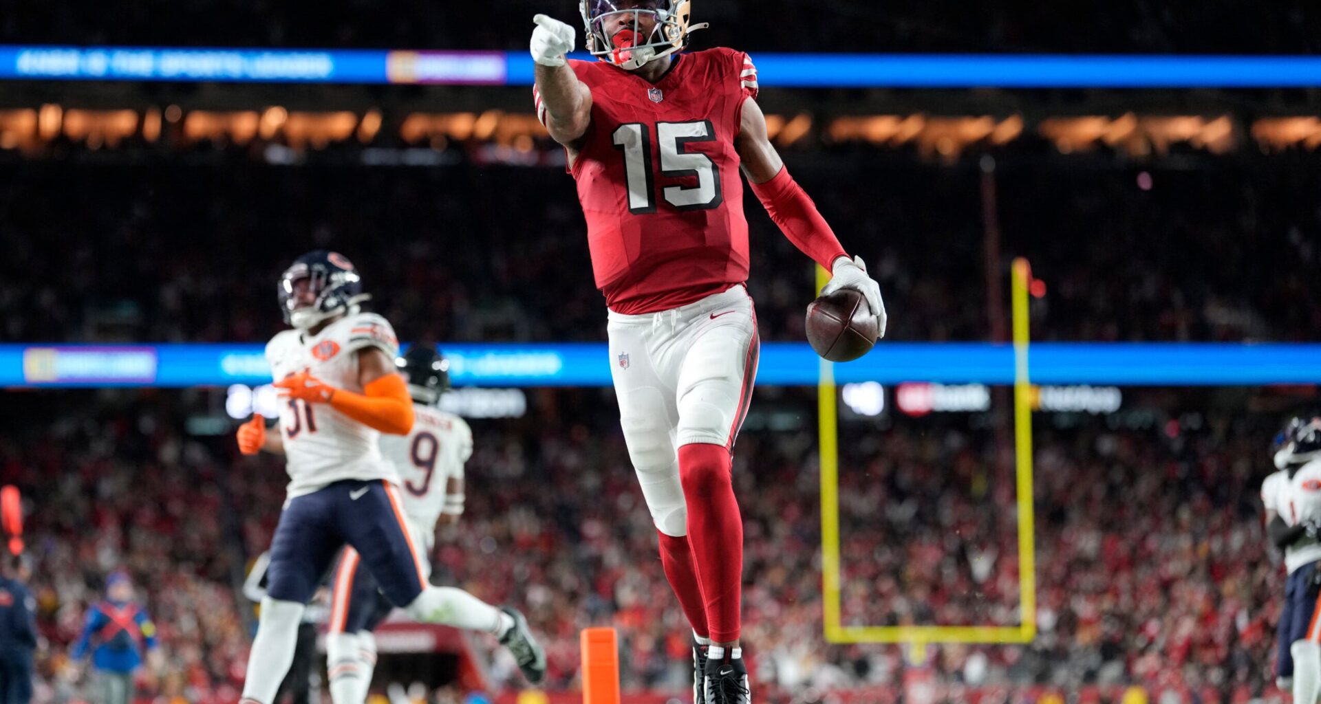 Dec 28, 2025; Santa Clara, California, USA; San Francisco 49ers wide receiver Jauan Jennings (15) runs to score a touchdown against the Chicago Bears in the second half at Levi's Stadium.