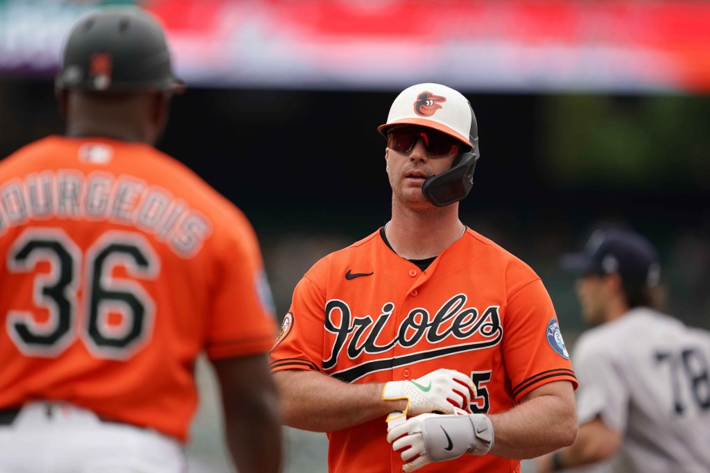 Baltimore Orioles first baseman Pete Alonso (25) returns to the dugout after driving in a run and being caught in a rundown during the third inning against the New York Yankees at Oriole Park at Camden Yards.
