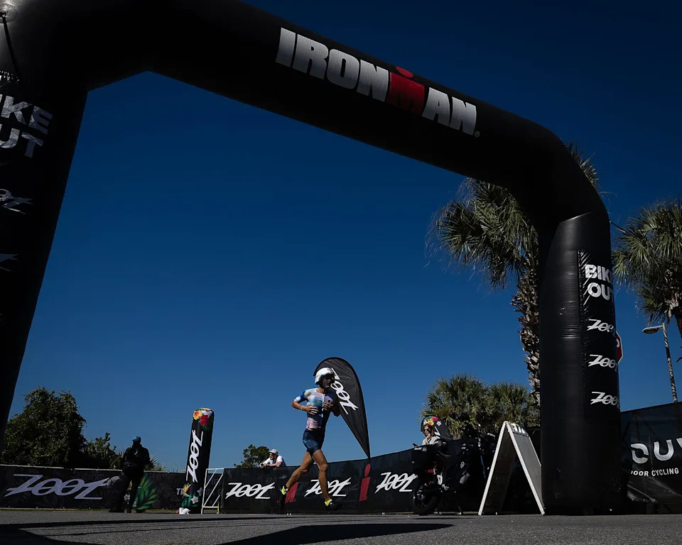 An athlete runs towards the final 26.2-mile running stage of the Visit Panama City Beach IRONMAN Florida triathlon Nov. 1, 2025. (Tyler Orsburn/News Herald)