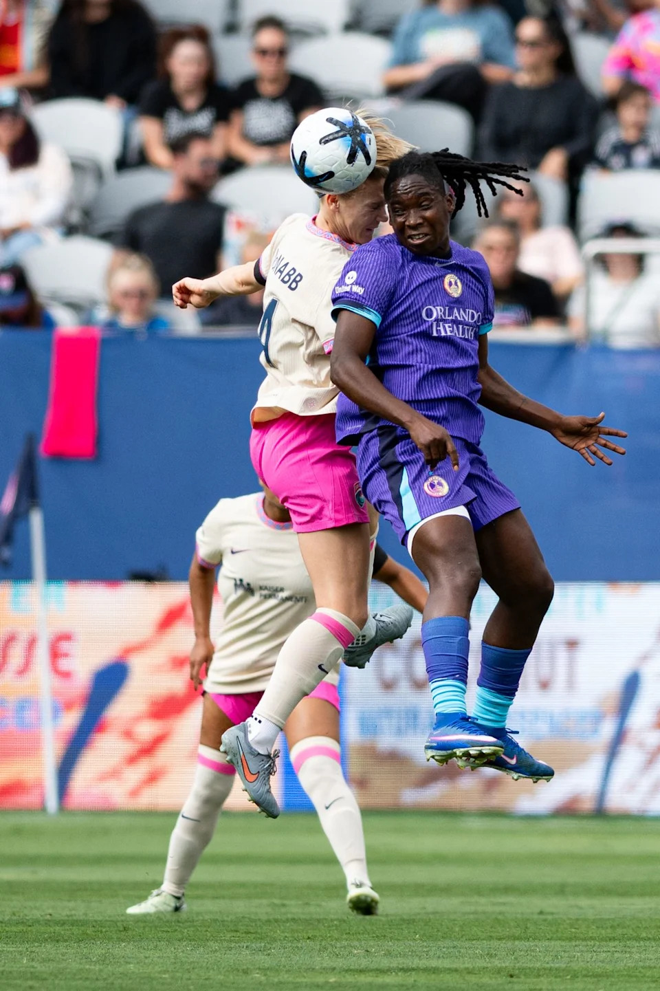 San Diego Wave defender Kristen McNabb (14) heads the ball away from Orlando Pride SC forward Barbra Banda (11) during an NWSL match between Orlando Pride SC and San Diego Wave FC on Sunday, May 24, 2026 at Snapdragon Stadium in San Diego Calif.