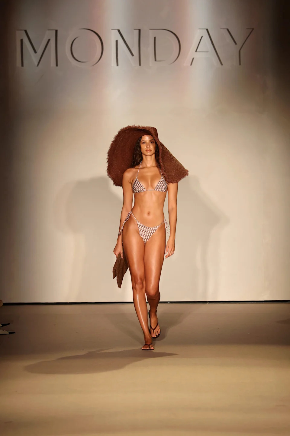 A model walks the runway for the Monday Swimwear 2026 Runway Show.