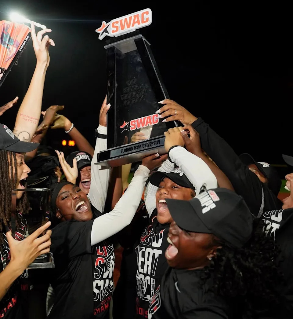 Florida A&M Rattlers players hoist the NCAA Southwestern Athletic Conference Softball Tournament championship trophy after beating the Southern Jaguars at the Gulfport Sportsplex in Gulfport, Mississippi, Saturday, May 9, 2026.