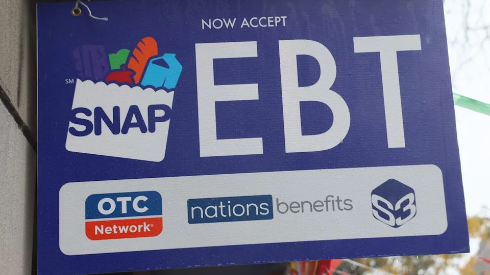 <div>NEW YORK, NEW YORK - OCTOBER 30: An EBT sign is displayed on the window of a grocery store on October 30, 2025 in the Flatbush neighborhood of the Brooklyn borough in New York City. Supplemental Nutrition Assistance Program (SNAP) benefits and other assistance are set to stop on November 1st amid a federal government shutdown that has been going on for 29 days and is the second-longest shutdown in the nation's history. New York Gov. Kathy Hochul declared a state of emergency for extra emergency funds and personnel to be deployed, as SNAP payments will be suspended. About 42 million Americans are expected to lose access to their benefits. (Photo by Michael M. Santiago/Getty Images)</div>
