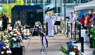 A member of the Navy Band Southeast plays taps during a Memorial Day observance at the Jacksonville Veterans Memorial Wall.