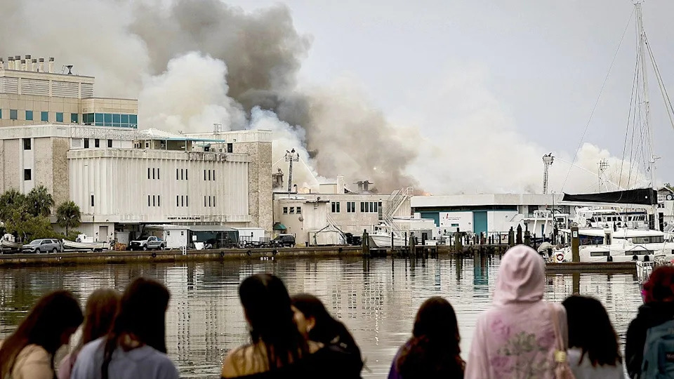 Firefighters extinguishing fire on University of South Florida campus in St. Petersburg