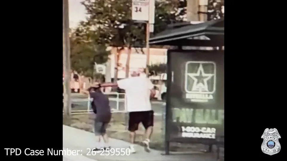 Surveillance footage shows a man approaching a woman near a bus stop in Tampa before an alleged robbery
