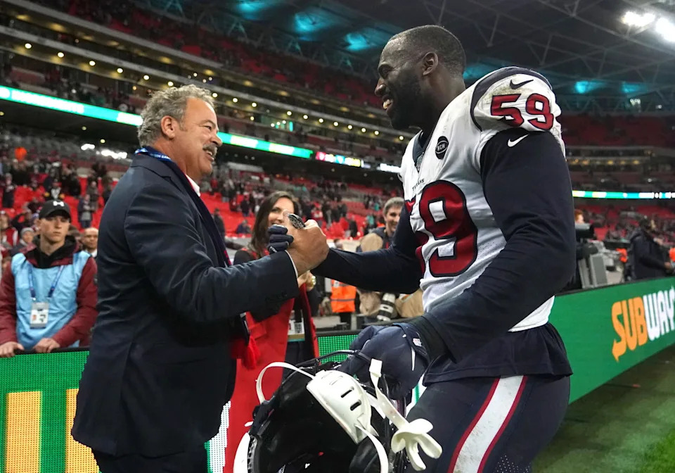 Houston Texans chief executive officer D. Cal McNair (left) shakes hands with outside linebacker Whitney Mercilus (59) after an NFL International Series game against the Jacksonville Jaguars at Wemble... Kirby Lee-Imagn Images