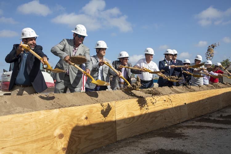 Officials mark groundbreaking with ceremonial shovels