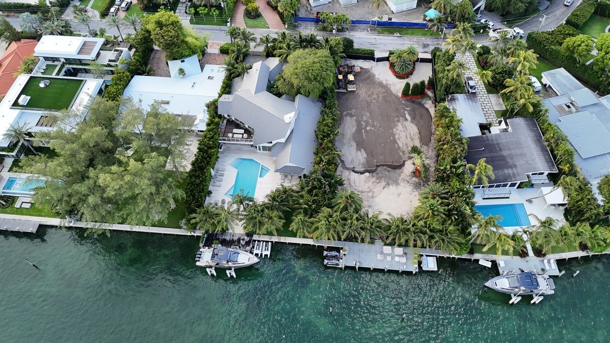 Gisele Bündchen spotted in Miami as her waterfront estate undergoes major expansion following purchase of adjacent multimillion-dollar property.