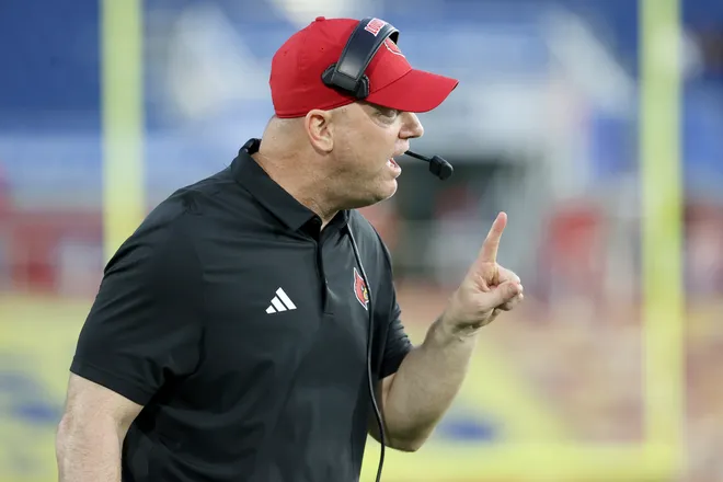 BOCA RATON, FLORIDA - DECEMBER 23: Head Coach Jeff Brohm of the Louisville Cardinals shouts instructions during the second half of the 2025 Bush's Boca Raton Bowl of Beans game against the Toledo Rockets at Flagler Credit Union Stadium on December 23, 2025 in Boca Raton, Florida. (Photo by Leonardo Fernandez/Getty Images)