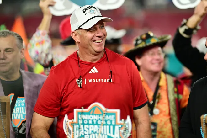 TAMPA, FLORIDA - DECEMBER 19: Head coach Dave Doeren of the NC State Wolfpack reacts after winning the 2025 Union Home Mortgage Gasparilla Bowl against the Memphis Tigers at Raymond James Stadium on December 19, 2025 in Tampa, Florida. The NC State Wolfpack defeated the Memphis Tigers 31-7. (Photo by Julio Aguilar/Getty Images)