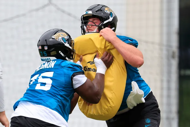 Jacksonville Jaguars offensive lineman Emmanuel Pregnon (75), left, drills on outside linebacker Garrett DiGiorgio (74) during rookie minicamp at the Miller Electric Center, Saturday, May 9, 2026 in Jacksonville, Fla. Today was the second of a three day camp concluding Sunday.