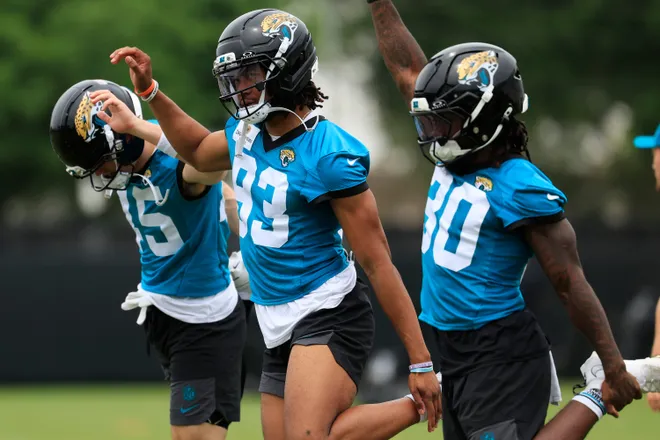Jacksonville Jaguars wide receiver Ben Patterson (83), center, stretches during rookie minicamp at the Miller Electric Center, Saturday, May 9, 2026 in Jacksonville, Fla. Today was the second of a three day camp concluding Sunday.