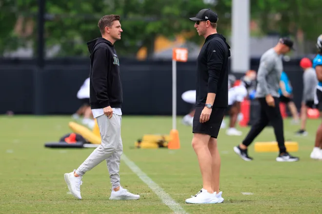 Jacksonville Jaguars general manager James Gladstone, left, and head coach Liam Coen talk during rookie minicamp at the Miller Electric Center, Saturday, May 9, 2026 in Jacksonville, Fla. Today was the second of a three day camp concluding Sunday.